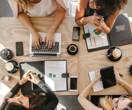 Group of women working together in coffee shop