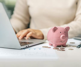 Business accountant calculates income-expenses to save money for the future.